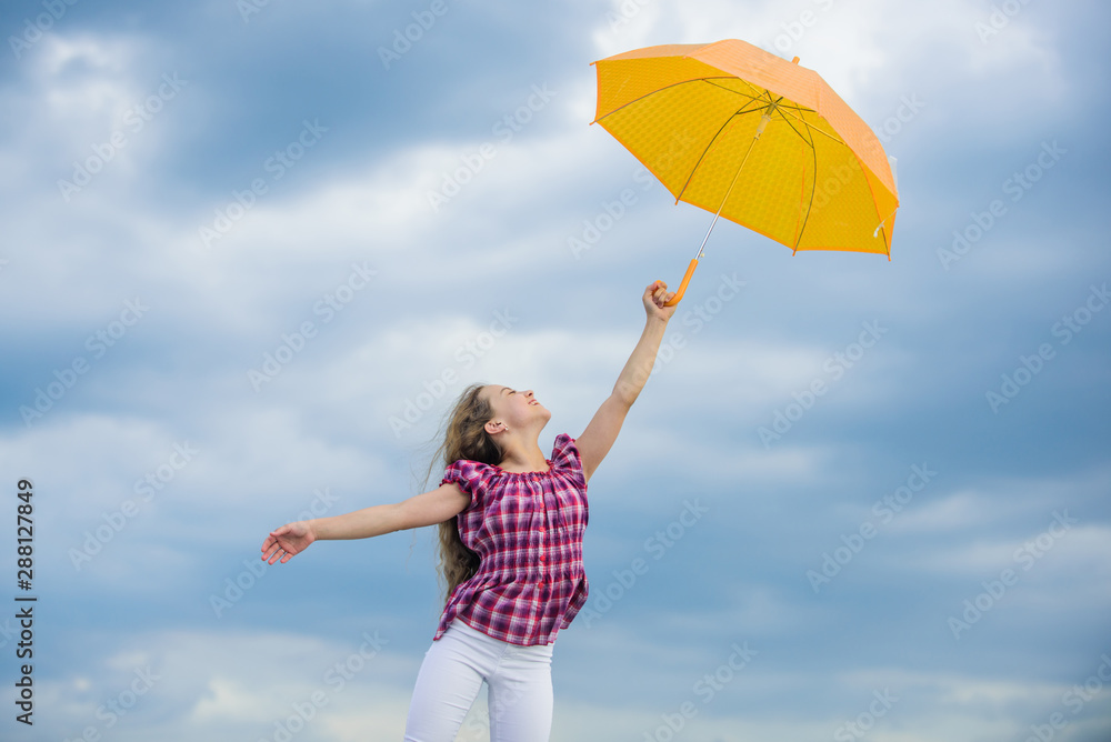 child fly in cloudy sky. rain protection. happy small girl with umbrella. positive mood at any school time. autumn season. rainy weather forecast. fall kid fashion. Everyday winner Stock-foto Adobe