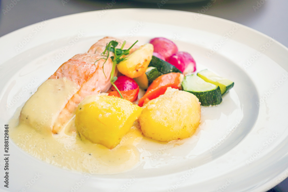 Grilled Salmon with fresh lettuce and mash potatoes Grilled Salmon with fresh lettuce and mash potatoes