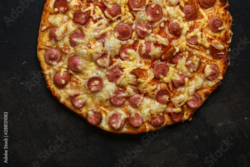 pizza with sausages (tomato sauce, cheese). food background. top view. copy space