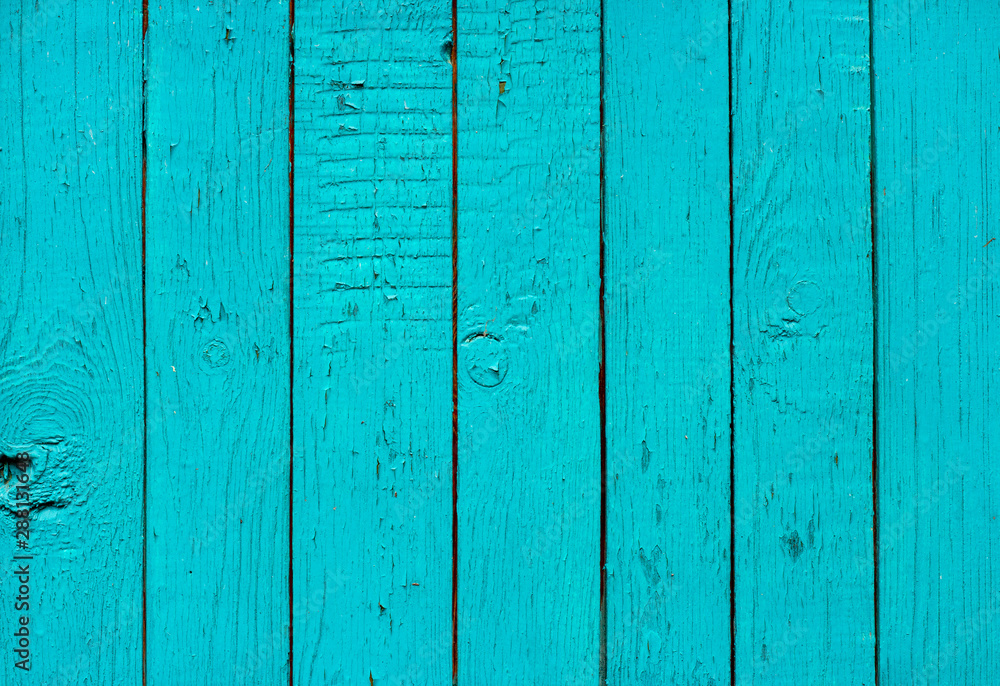 Old grunge rustic vertical wooden texture background with blue color cracked weathered paint and scratches Old grunge rustic vertical wooden texture background with blue color cracked weathered paint and scratches