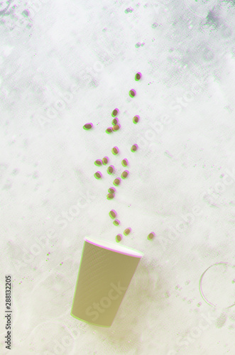 Black paper cup with scattered coffee beans and tubules on gray old concrete background. 3D effect. Glitch style effect. Vibrant duotone yellow, violet colors. Top view with copy space.