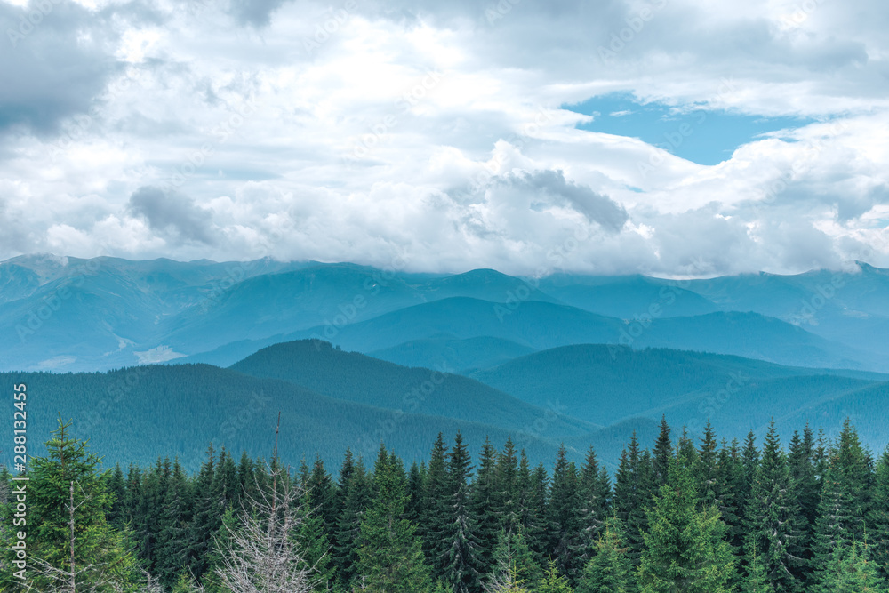 Carpathian mountains landscape with blue sky and clouds, nature background