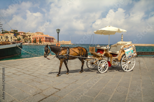 Tourist cart with a horse on the old promenade in Chania. Greece. Crete.