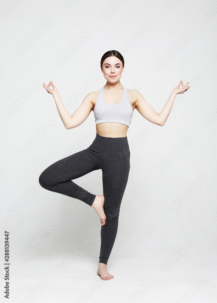 sport, yoga and people concept - lovely young woman doing yoga, sports exercises for relaxation and meditation sport, yoga and people concept - lovely young woman doing yoga, sports exercises for relaxation and meditation