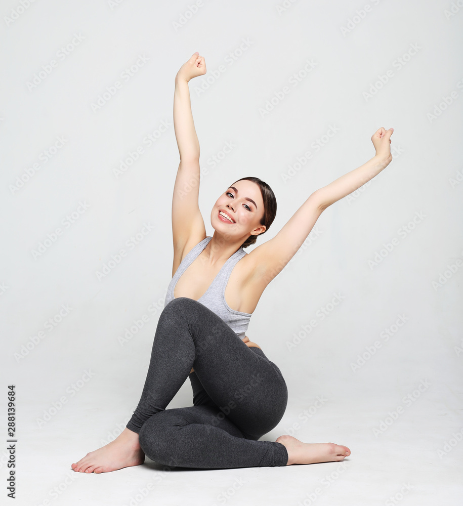 sport, yoga and people concept - lovely young woman doing yoga, sports exercises for relaxation and meditation sport, yoga and people concept - lovely young woman doing yoga, sports exercises for relaxation and meditation
