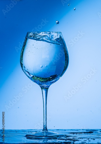 glass  wine  drink  water  alcohol  wineglass  blue  isolated  empty  white  liquid  transparent  clear  beverage  clean  object  crystal  goblet  reflection  drop  bar  single  fresh  cold  celebrati