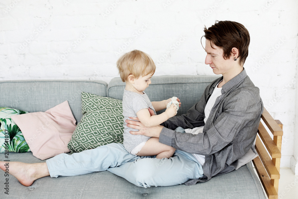 Young dad with his son at home, have a great time together, happy time, young family Young dad with his son at home, have a great time together, happy time, young family