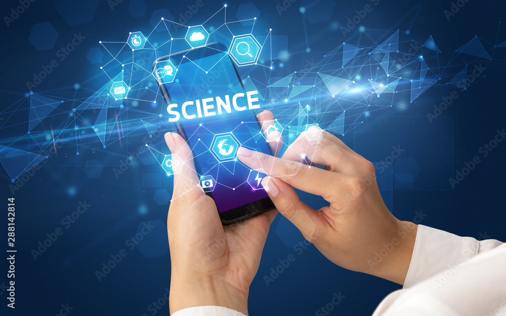 Female hand holding smartphone with SCIENCE inscription, modern technology concept Female hand holding smartphone with SCIENCE inscription, modern technology concept