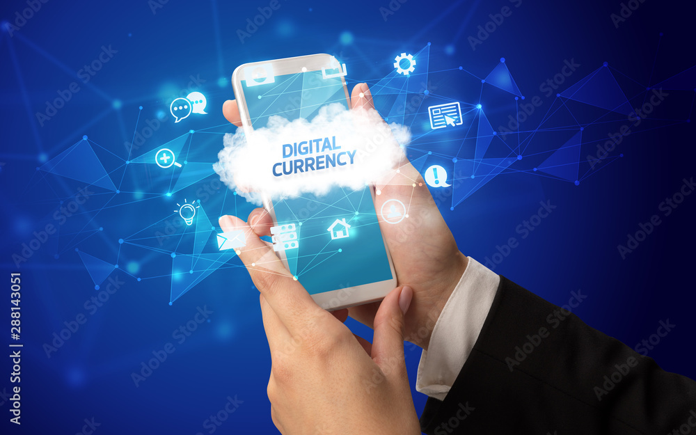 Female hand holding smartphone with DIGITAL CURRENCY inscription, cloud technology concept Female hand holding smartphone with DIGITAL CURRENCY inscription, cloud technology concept