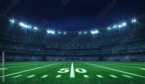 Fotografia American football league stadium with white lines and fans, illuminated field si