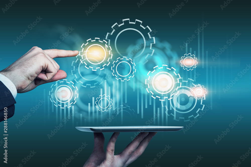 Man with tablet using gear interface