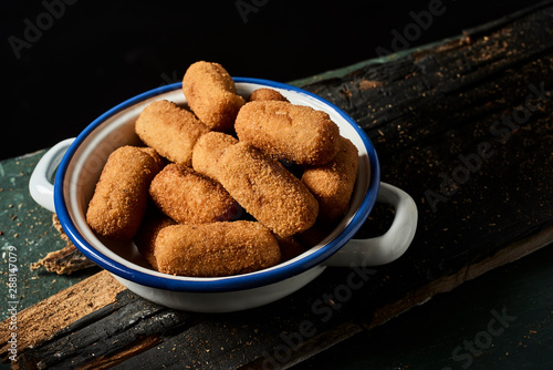 Obraz na plátne spanish croquettes on a rustic wooden table.