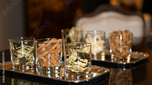 Dry food in many glasses for snacks.