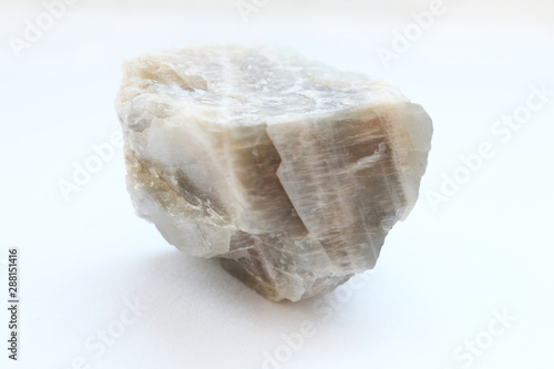 Foto Textured misty moon stone isolated on white background