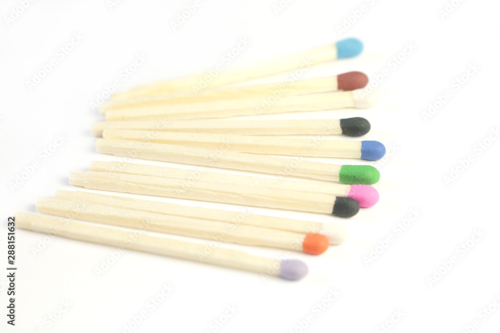 Row of colorful matches isolated on white background