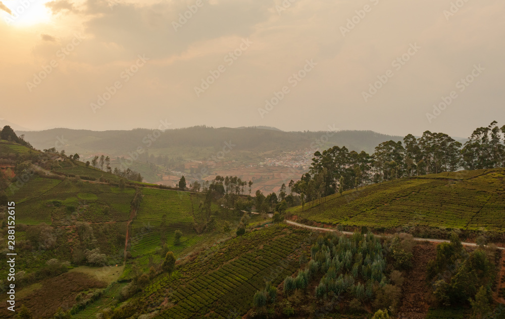 Road isolated in hills towards city Road isolated in hills towards city