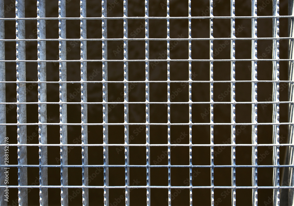 Dirty urban welded metal grid frame on black background Dirty urban welded metal grid frame on black background