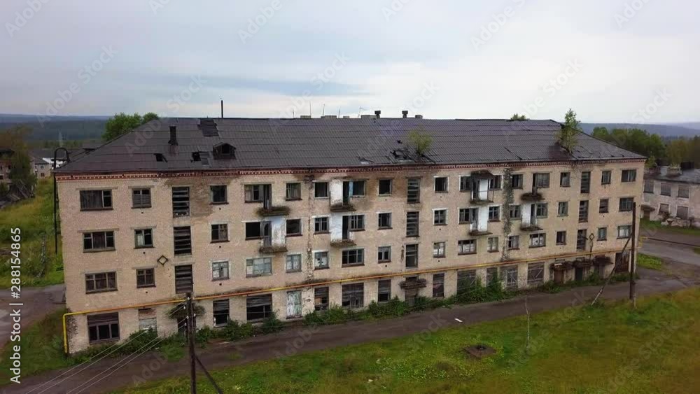 Old Abandoned Neglected Apartment Block. Urban Decay Concept. Aerial View Old Abandoned Neglected Apartment Block. Urban Decay Concept. Aerial View