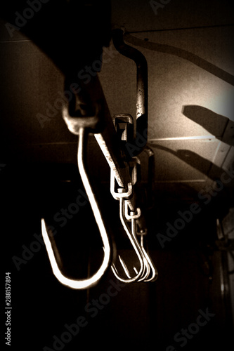 meat hook in walk in larder dark shadows creepy eerie scene