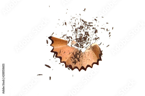 Coloring pencil shavings with small particles isolated on white background