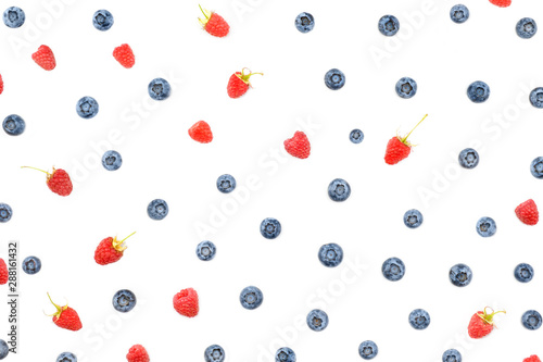 Fresh berries raspberry and blueberry isolated on white background.