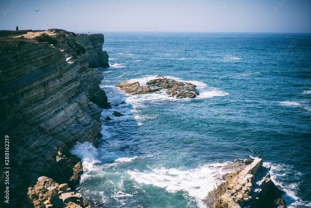 Beautiful seascape, Porugal, shore of the Atlantic Ocean, waves and rocks, retro tone