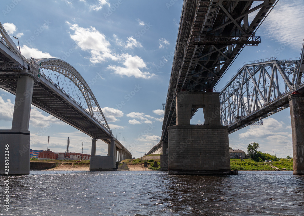 Fototapeta premium Railroad and road bridges over the Vilga river