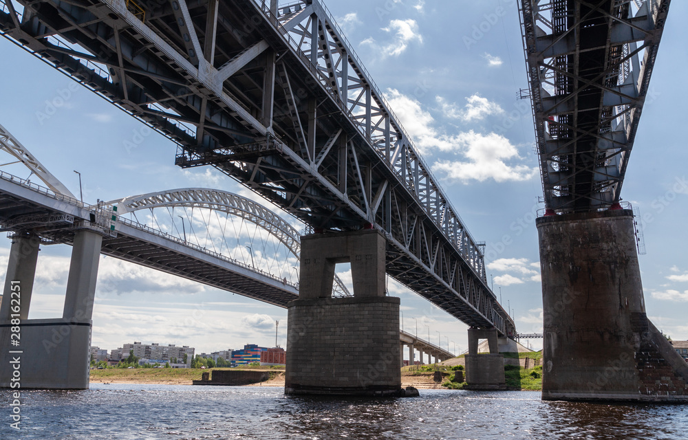 Fototapeta premium Railroad and road bridges over the Vilga river
