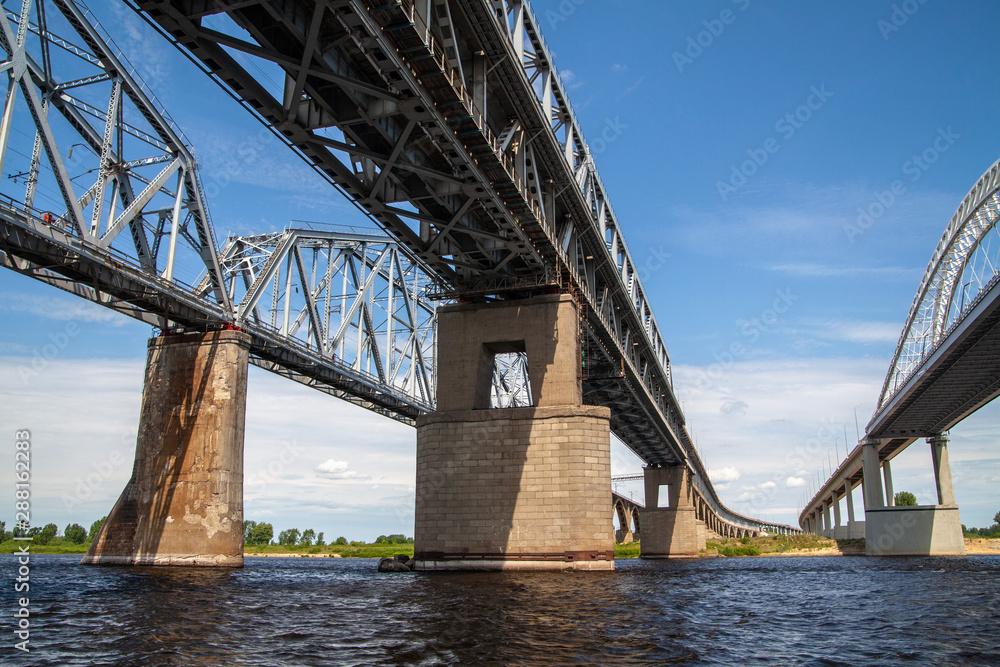 Fototapeta premium Railroad and road bridges over the Vilga river
