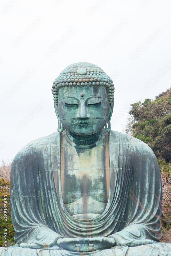 Giant buddha or Kamakura Daibutsu is the famous landmark located at the Kotoku-in temple in Kamakura,Japan Giant buddha or Kamakura Daibutsu is the famous landmark located at the Kotoku-in temple in Kamakura,Japan