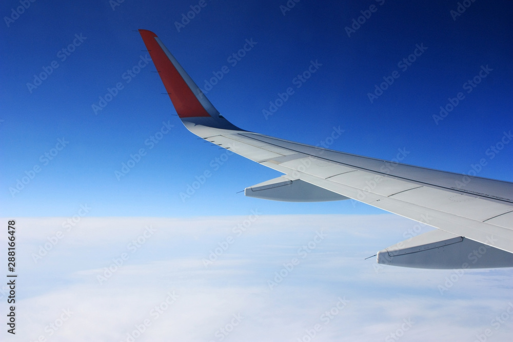 Airplane wing in blue sky Airplane wing in blue sky