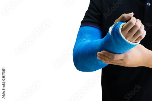 man holding hand with blue bandage as arm injury concept. photo