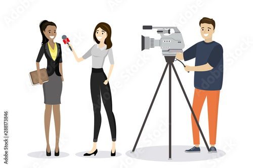 Female television reporter with microphone interviews business woman,