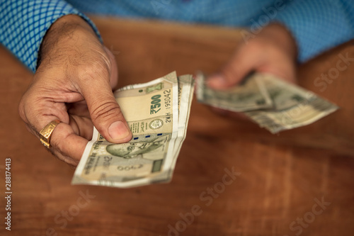 Businessman Giving Money