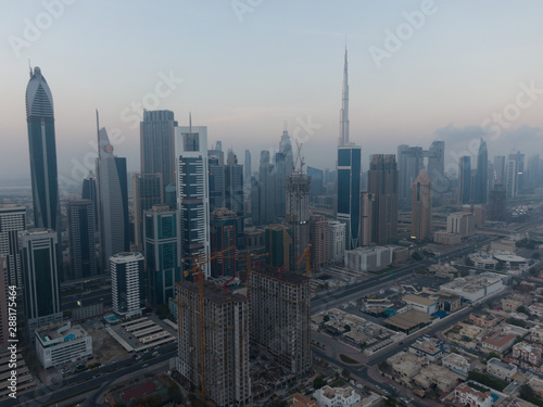 Aerial of the Cityscape of the financial district in Dubai, United Arab Emirates while sunrise