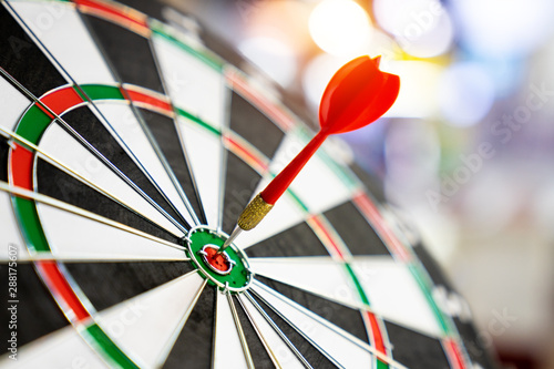 Darts board with arrows hitting the center target, focuses on success, planning to be smart concept.