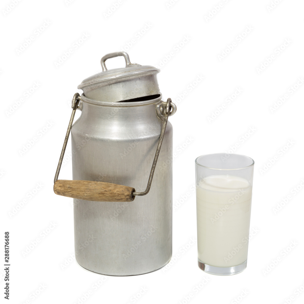 Glass of fresh milk and retro milk canister on white background Glass of fresh milk and retro milk canister on white background