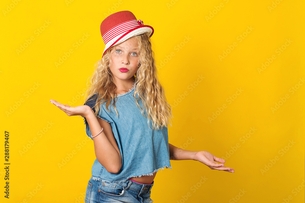 Happy stylish girl with long curly hair in summer fashion hat. Beauty and fashion. Young girl have decision, choice, decide choose, adverts Happy stylish girl with long curly hair in summer fashion hat. Beauty and fashion. Young girl have decision, choice, decide choose, adverts