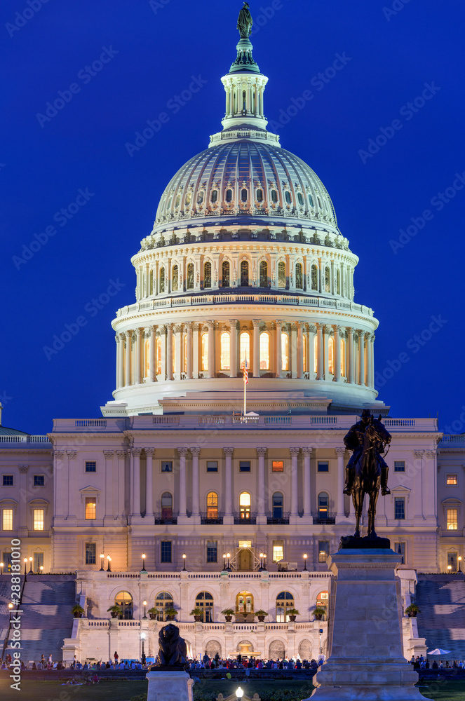 The Capitol at Night - A close-up view of west front of the U.S. Capitol Building, against a clear blue Summer night sky, Washington, D.C., USA. No recognizable trademark, logo or person in the image.