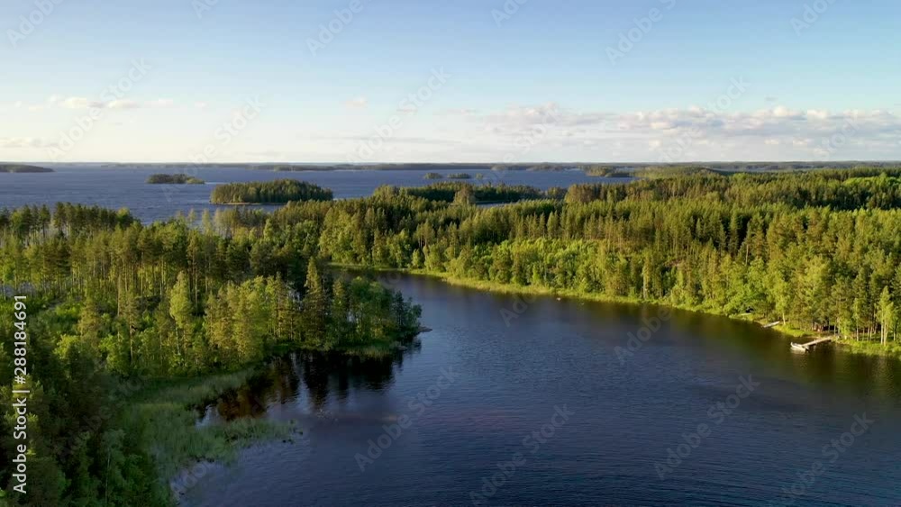 Finnish forest and lakes in Taipalsaari captured with drone on sunny day with some clouds Finnish forest and lakes in Taipalsaari captured with drone on sunny day with some clouds
