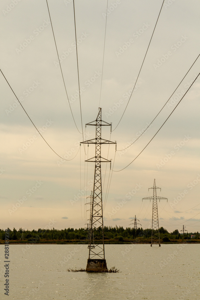 High support with high voltage power lines over water.