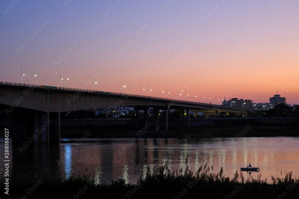Beautiful city illuminated by the setting sun Beautiful city illuminated by the setting sun