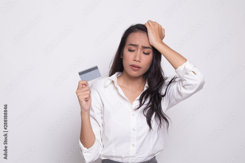 Young Asian woman headache with a blank card. Young Asian woman headache with a blank card.