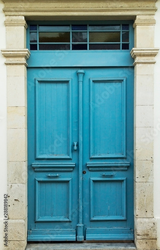 Blue front door in stone doorway