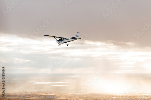 Beautiful white biplane in flight