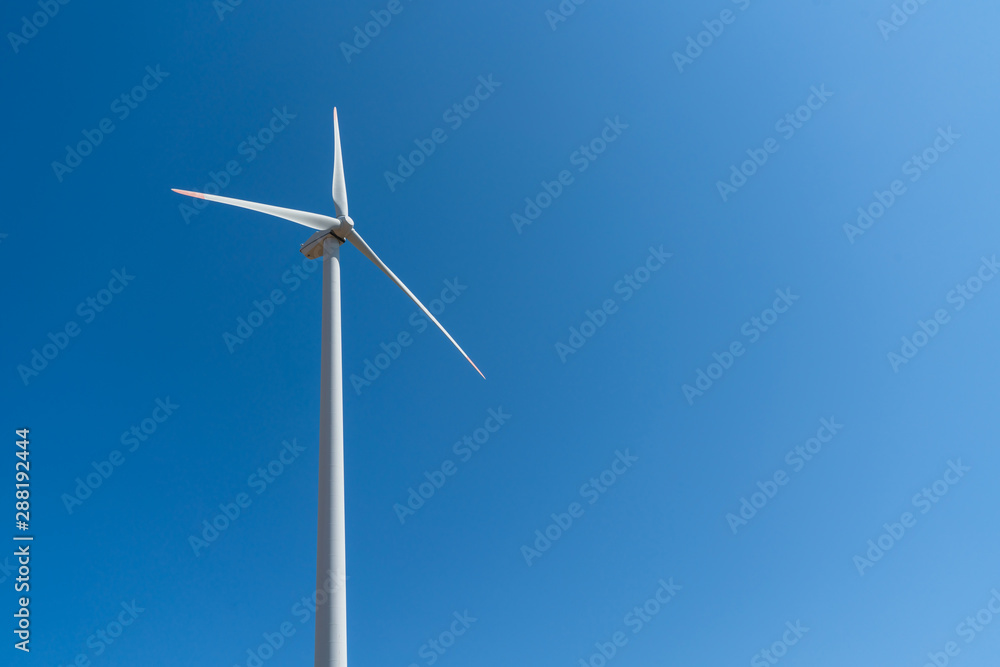 Wind turbine against a blue sky background Wind turbine against a blue sky background