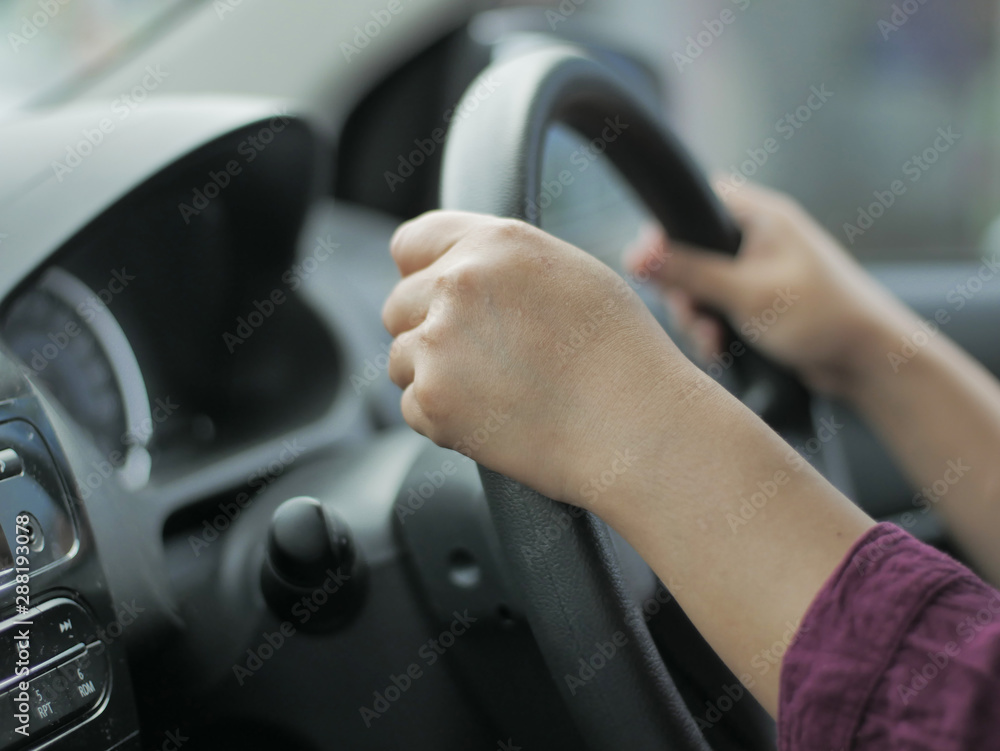 Close up of Hands Driving Car Concept