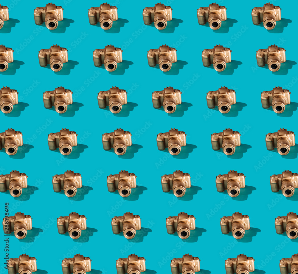 Golden SLR Camera Pattern on Bright Blue Golden SLR Camera Pattern on Bright Blue