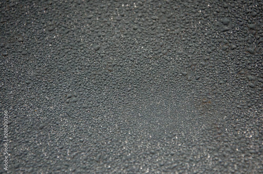 Background, water droplets on a gray glossy surface. Background, water droplets on a gray glossy surface.