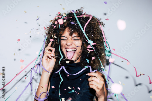 Mixed race woman celebrating a party photo